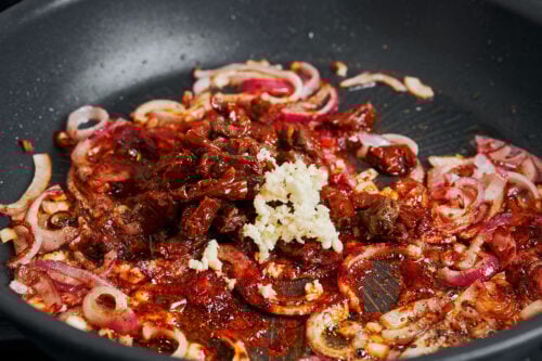 Caramelized onions mixed with sun-dried tomatoes and garlic