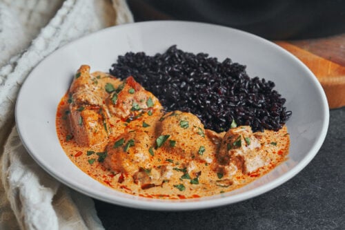Creamy caramelized onion chicken served with black rice