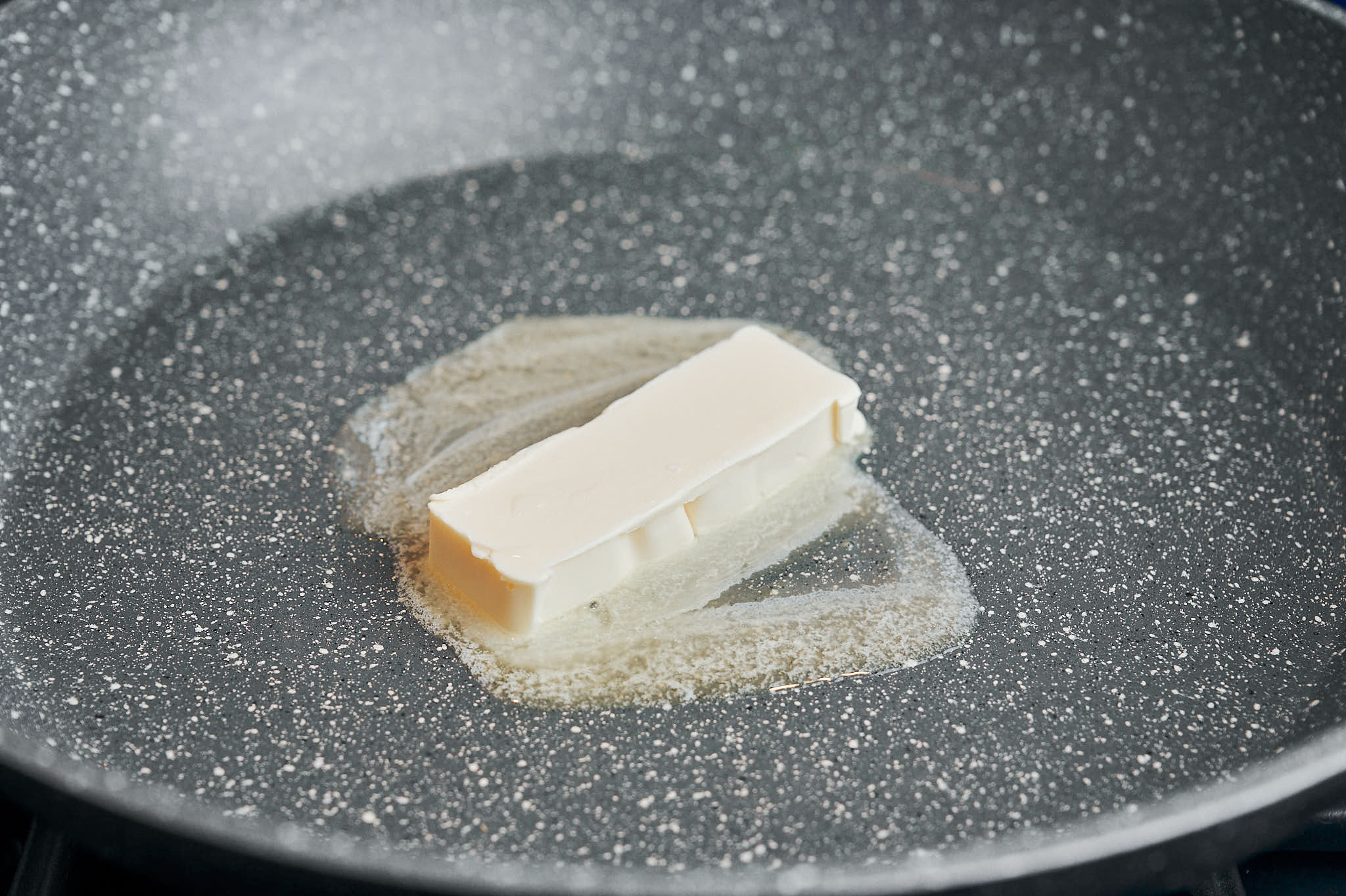 Butter melting in a hot skillet