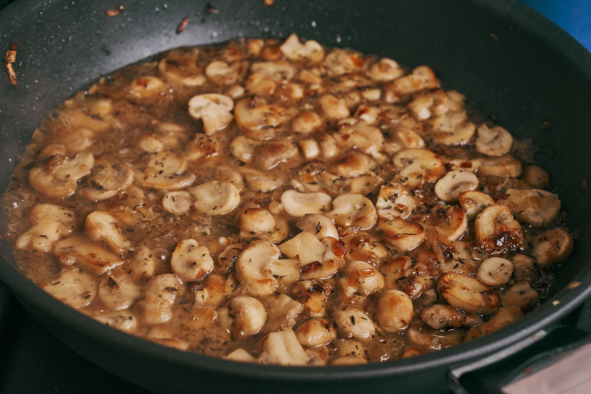 mushrooms simmering after deglazing with white wine