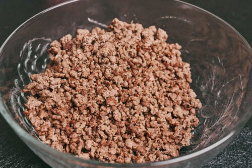 browned ground beef transferred to a bowl and set aside