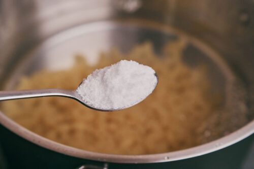 Salting pasta water before cooking elbow macaroni