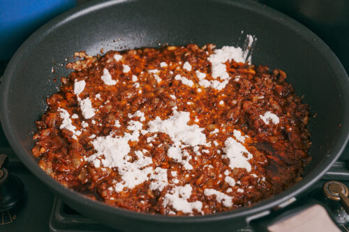 Flour stirred into sauce to create a roux