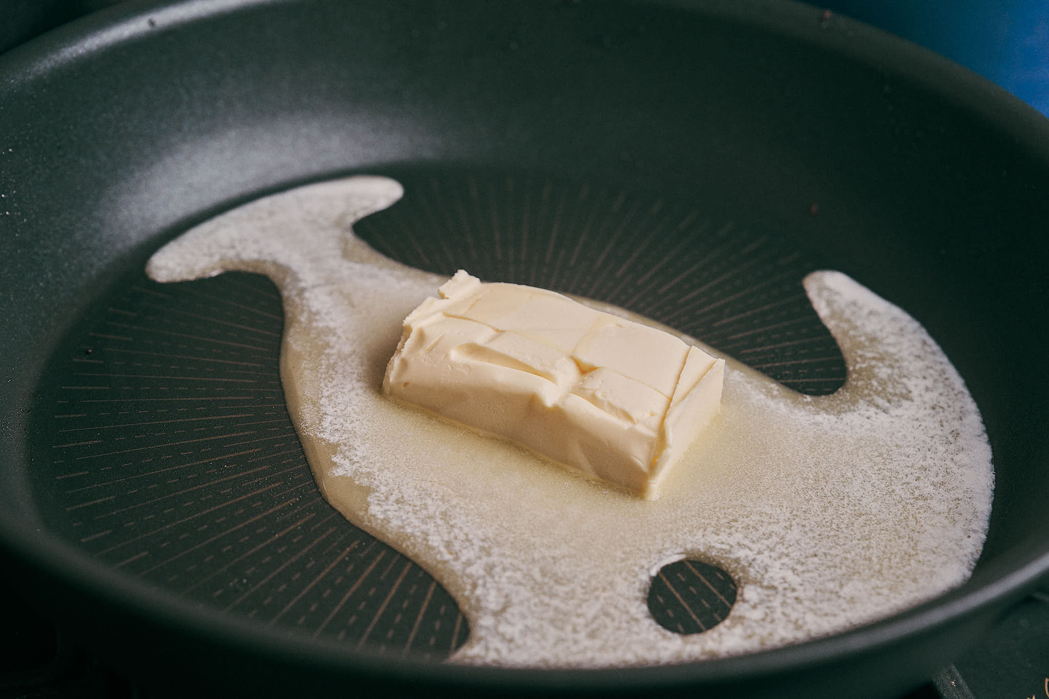Butter melting in a skillet to start the sauce