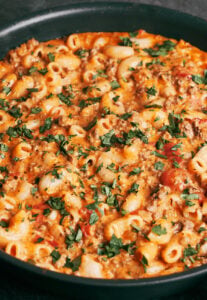 Creamy ground beef pasta with tender macaroni, seasoned beef, and melted cheese in a skillet