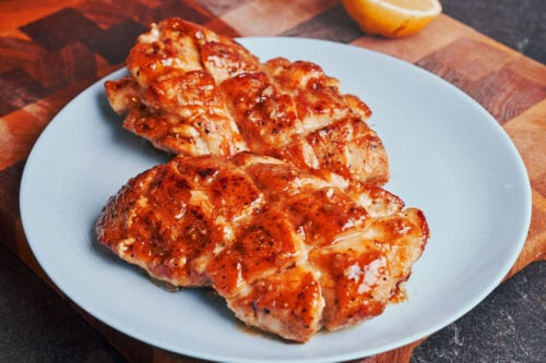 Golden chicken simmering in lemon butter sauce