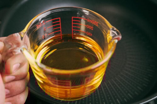Vegetable oil measured for beef and rice skillet