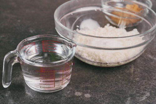 Rice, salt, and water prepared for soaking