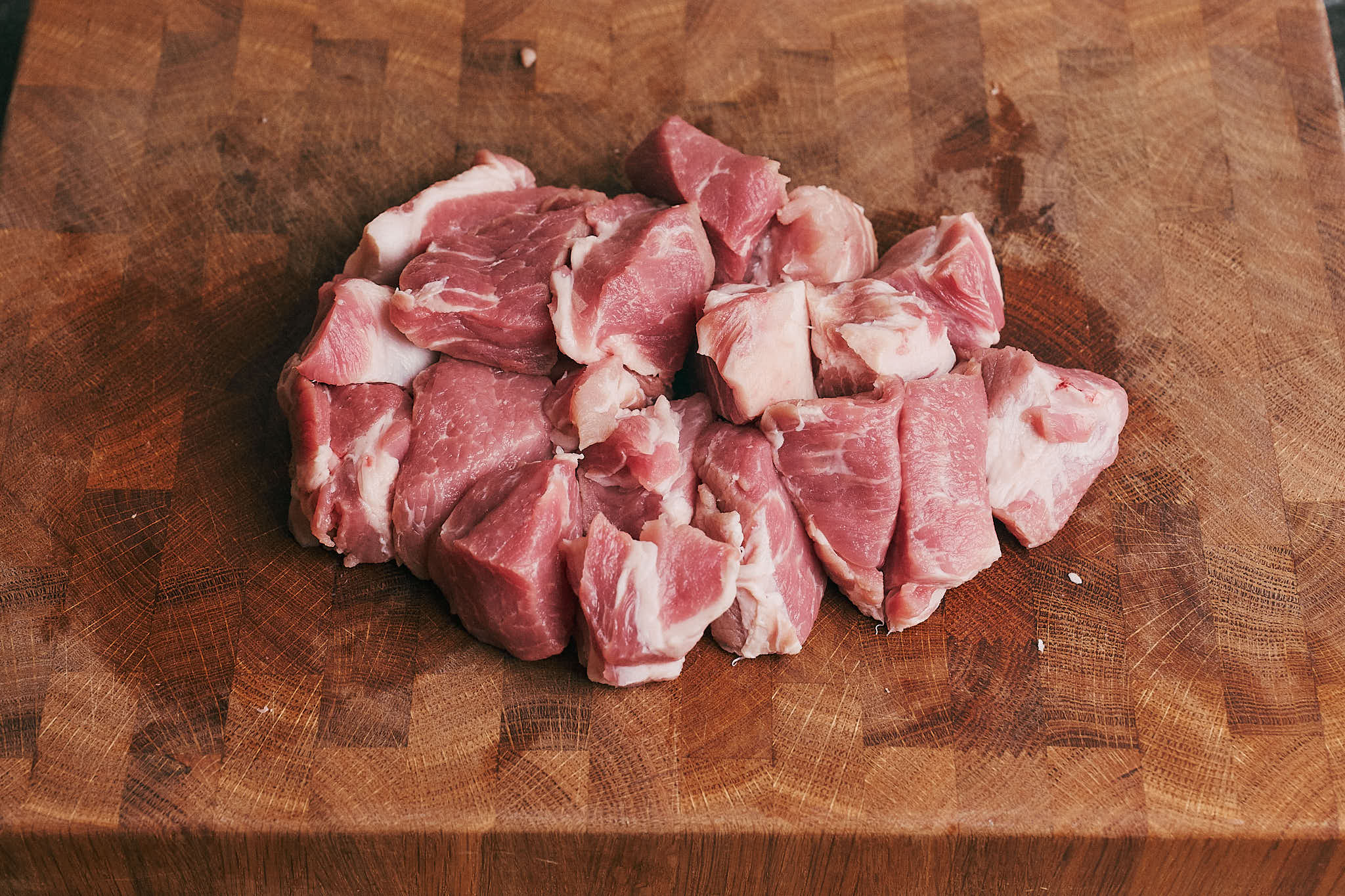 Cubed pork shoulder prepared for browning