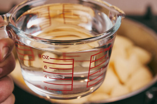 Water measured for stewed potatoes with pork