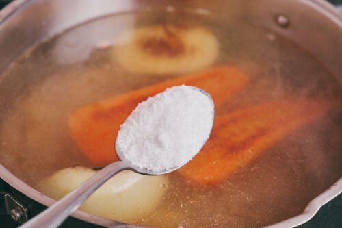 Adding salt to beef soup broth during simmering