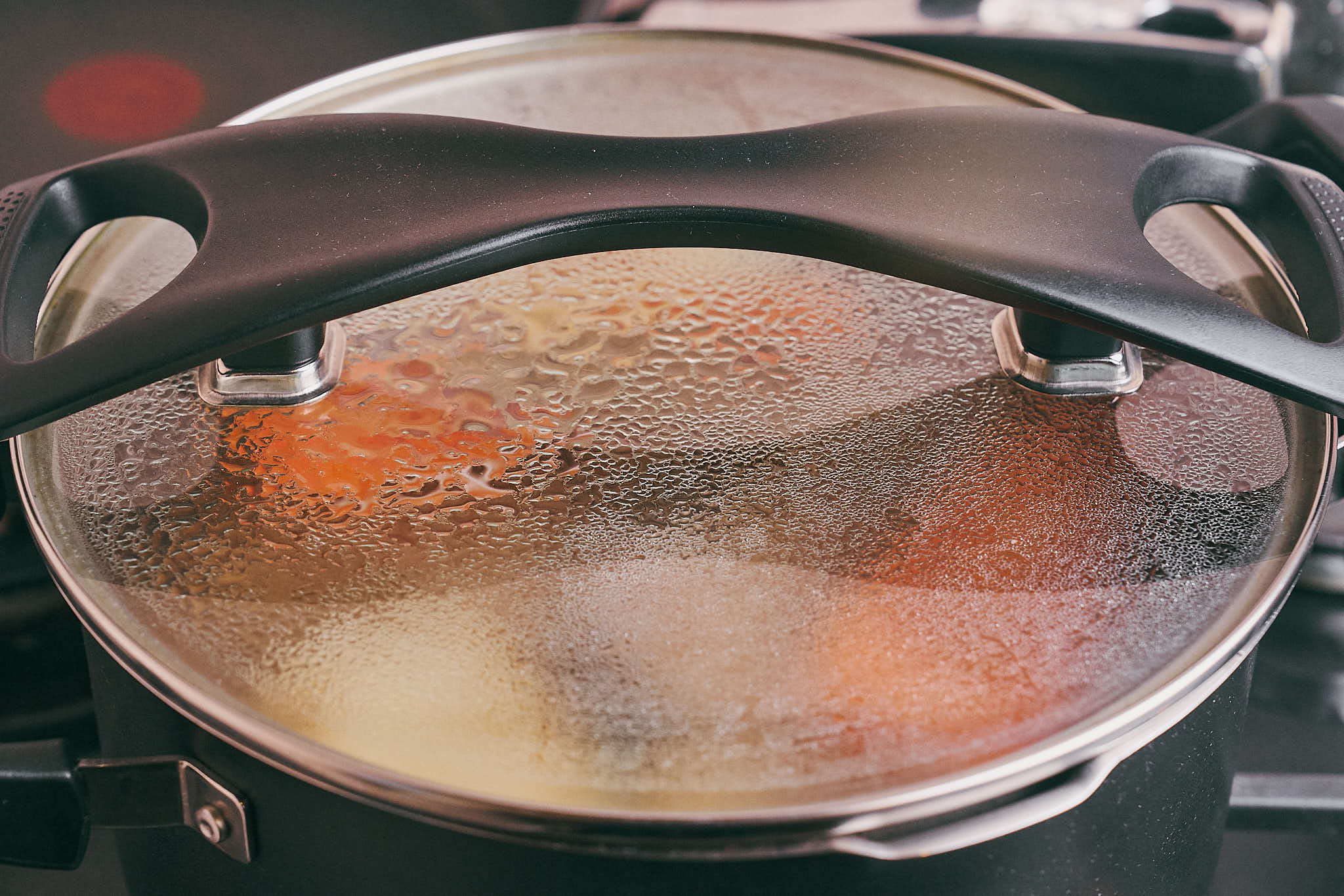 Beef soup simmering gently under a lid while the broth develops flavor
