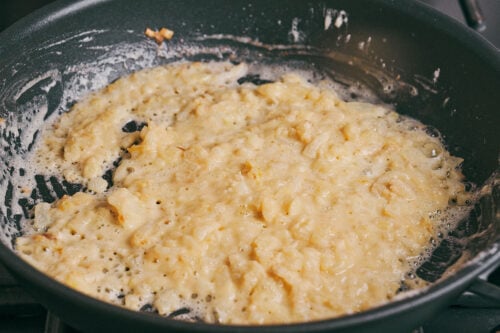 Thickened onion base cooking gently in a skillet