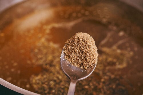 Ground coriander added to beef soup