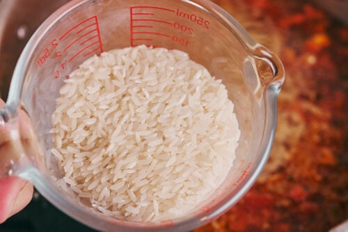 Uncooked rice added to beef soup