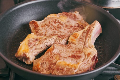 Beef on the bone seared until golden to build deep flavor for soup
