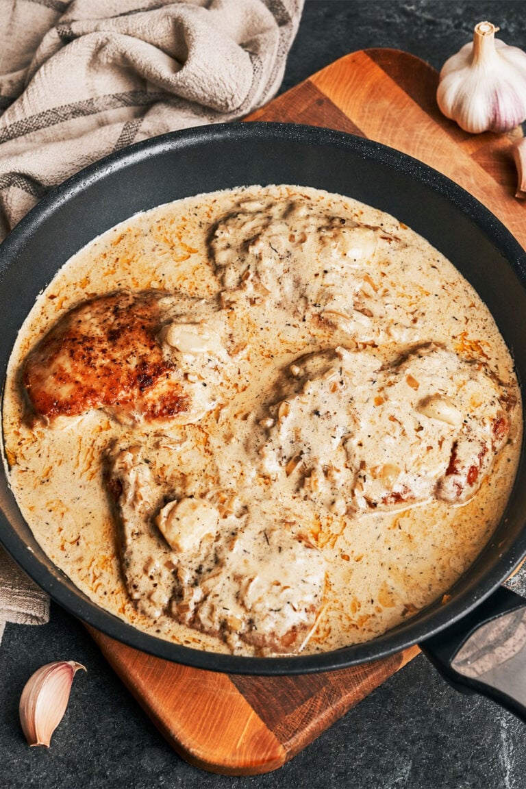 Creamy garlic chicken plated with tender chicken breast and rich garlic cream sauce