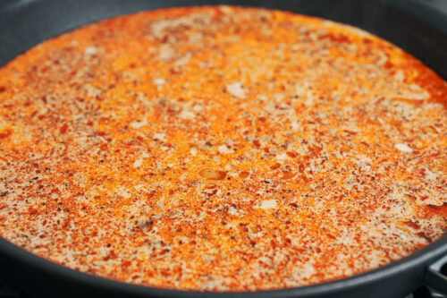 Ground beef and rice simmering in creamy sauce