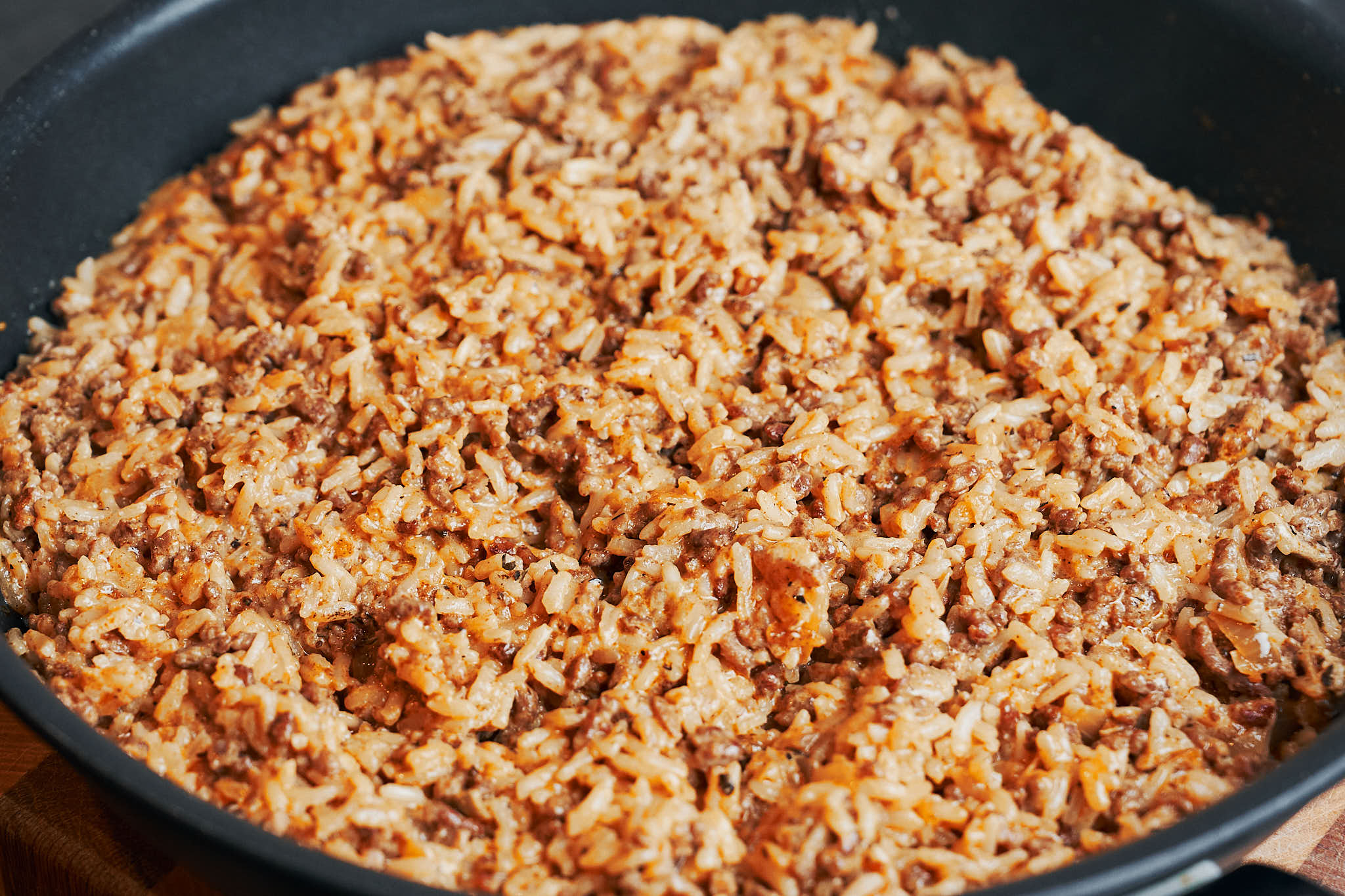 Creamy ground beef and rice finished and ready to serve in a skillet