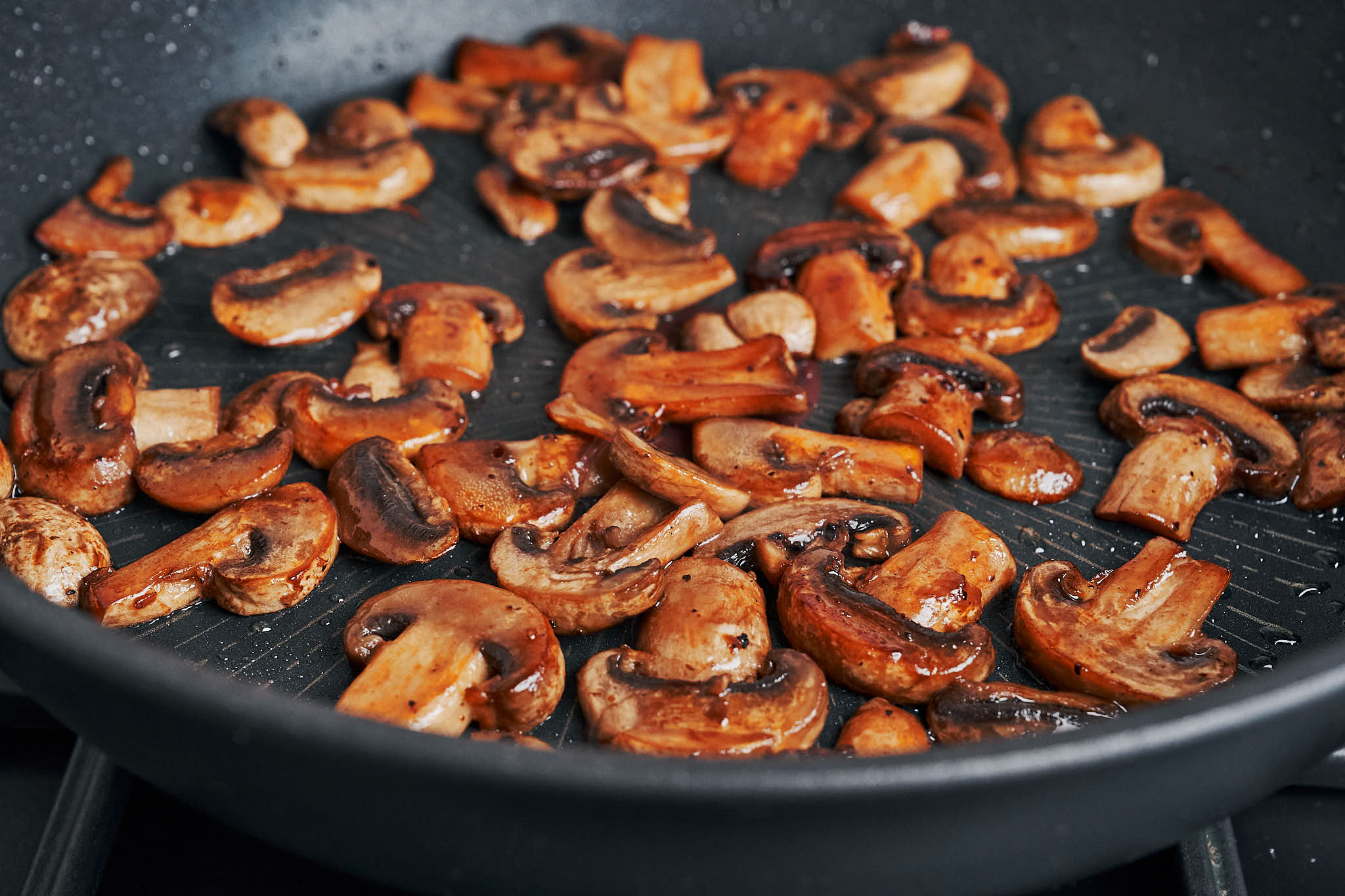 browned mushrooms sautéed in a skillet