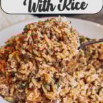 Creamy ground beef and rice skillet served in a bowl with Parmesan and herbs