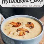 bowl of creamy mushroom potato soup topped with sautéed mushrooms