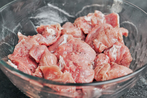 pork tenderloin medallions seasoned and ready to sear