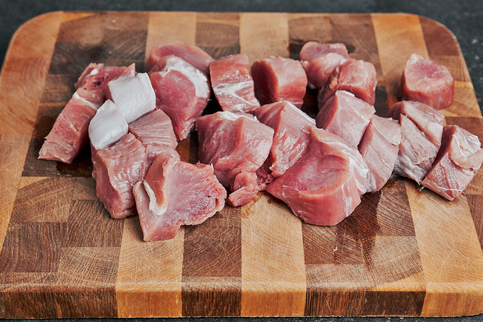 pork tenderloin cut into medallions on a cutting board