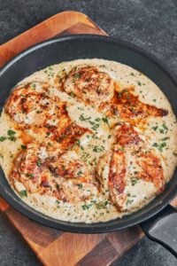 golden creamy parmesan chicken with rice and homemade parmesan sauce