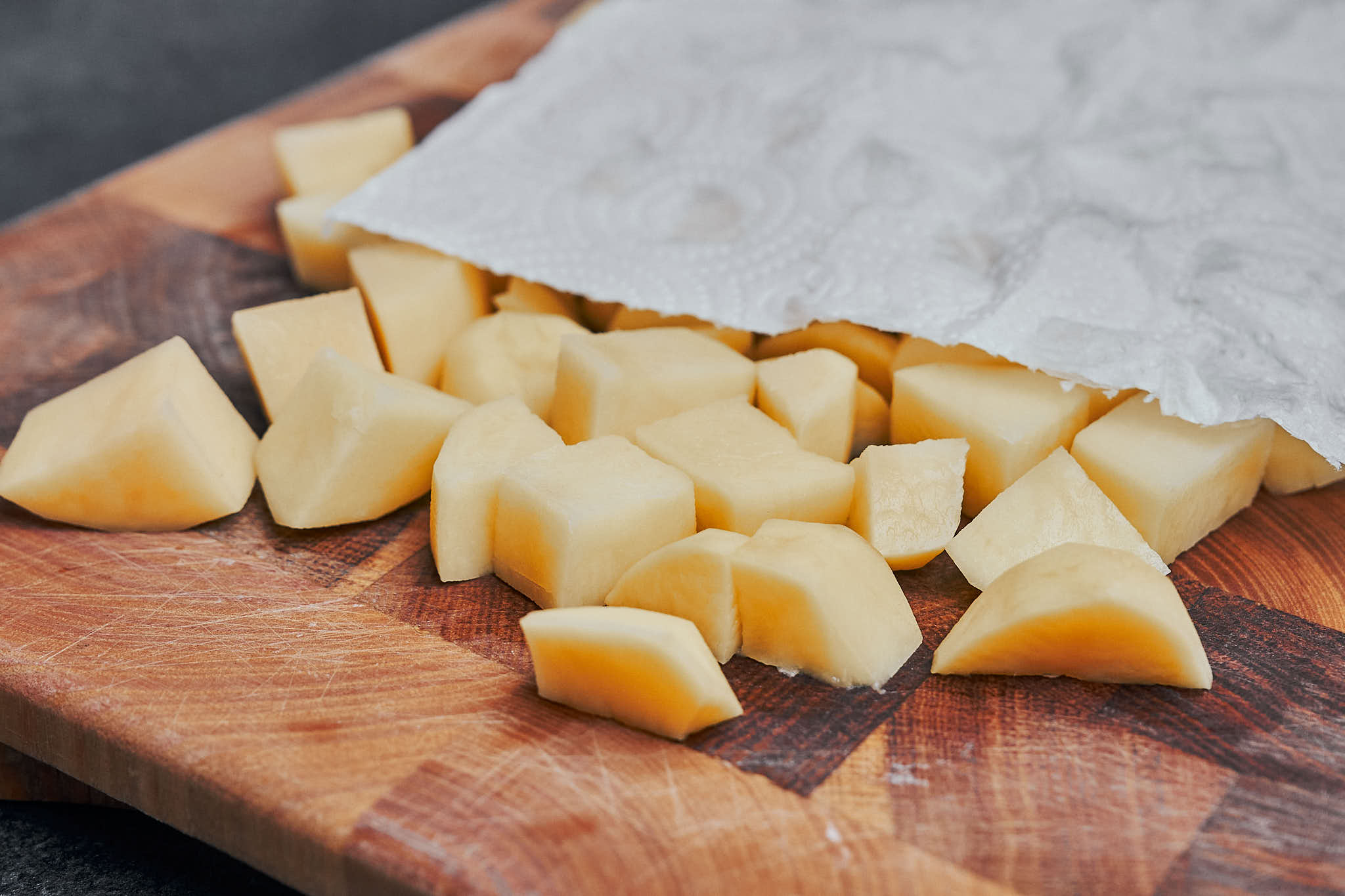 drying cubed potatoes with paper towel before cooking in skillet