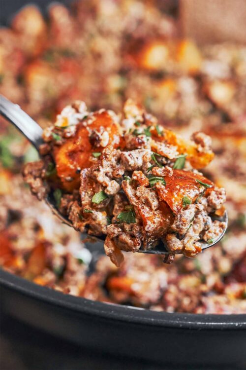 spoonful of ground beef and crispy potatoes fresh from the skillet