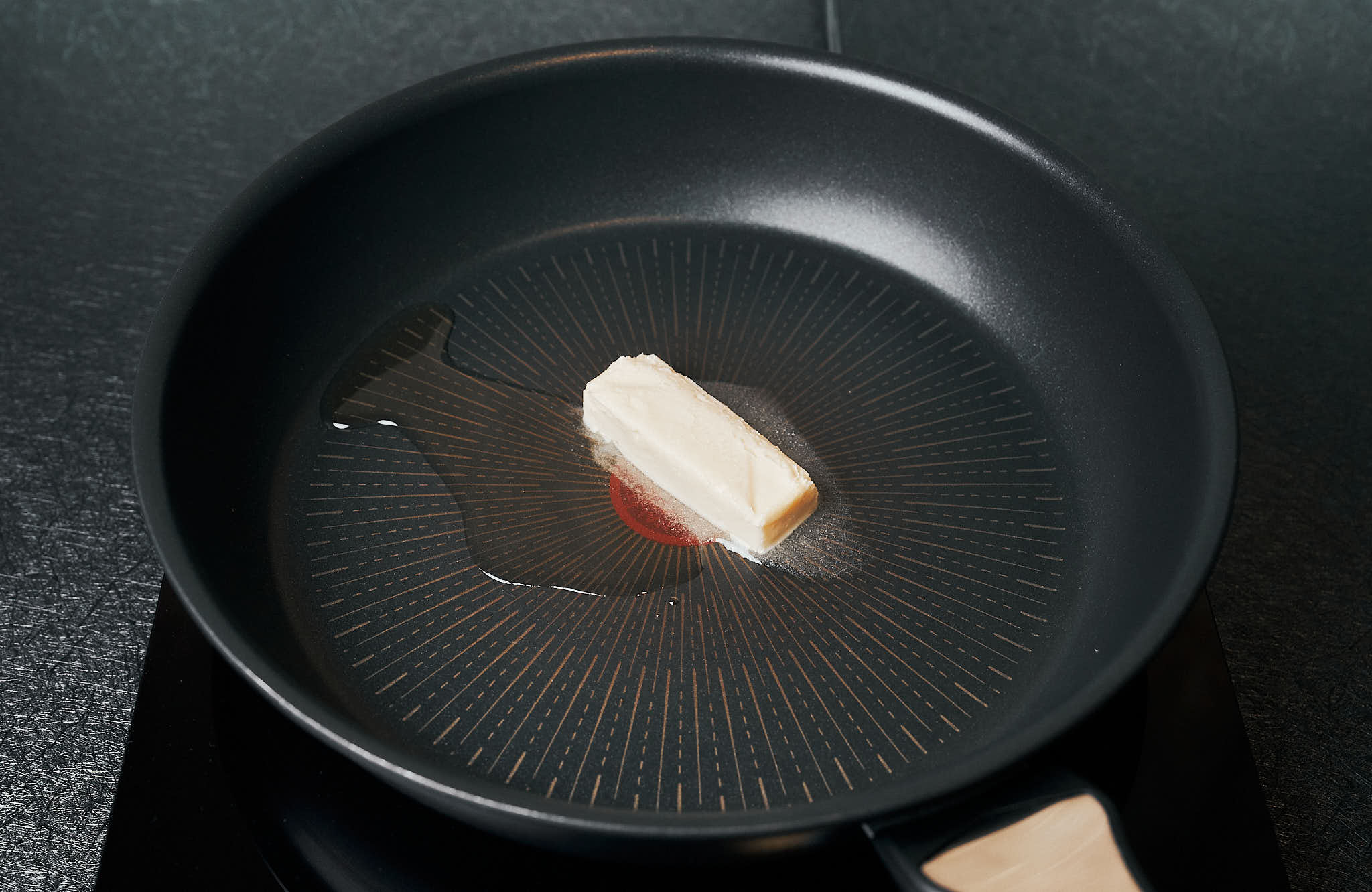 butter melting with olive oil in a skillet