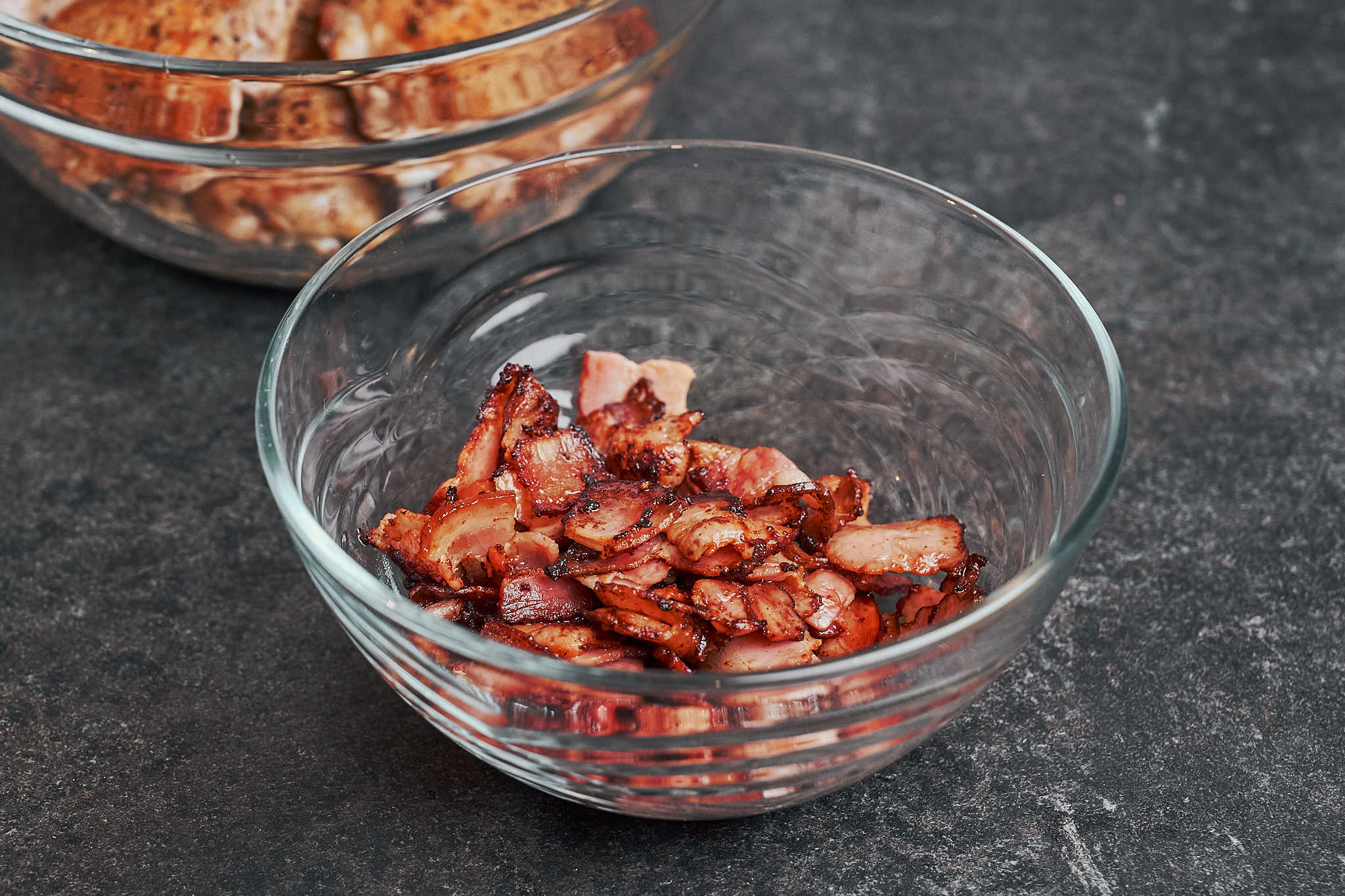 crispy bacon pieces in bowl after cooking