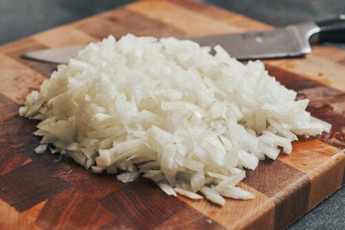 finely chopped onions on cutting board