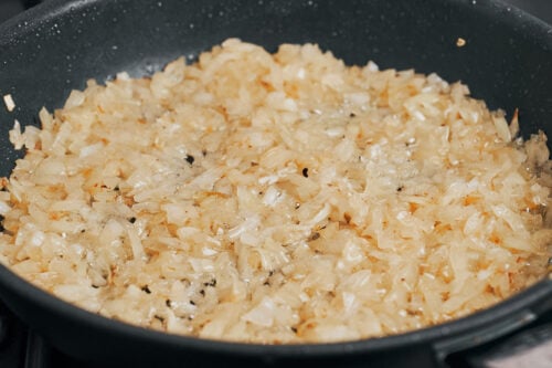 caramelized onions cooking in skillet until golden