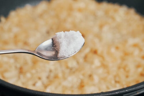 salt added to caramelized onions in skillet