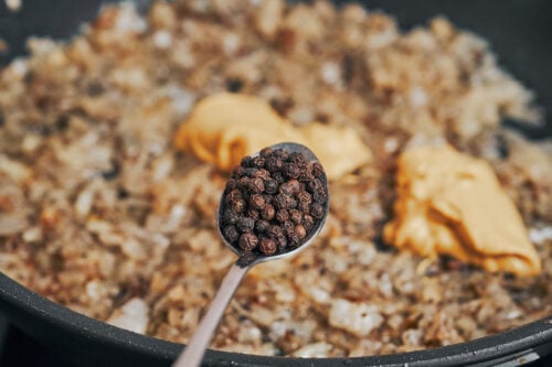 whole peppercorns added to sauce base in skillet