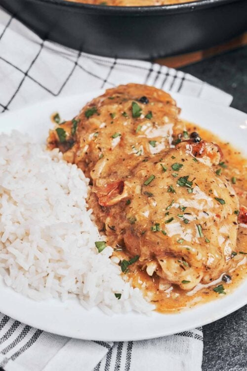 creamy chicken thighs in bacon sauce served with rice