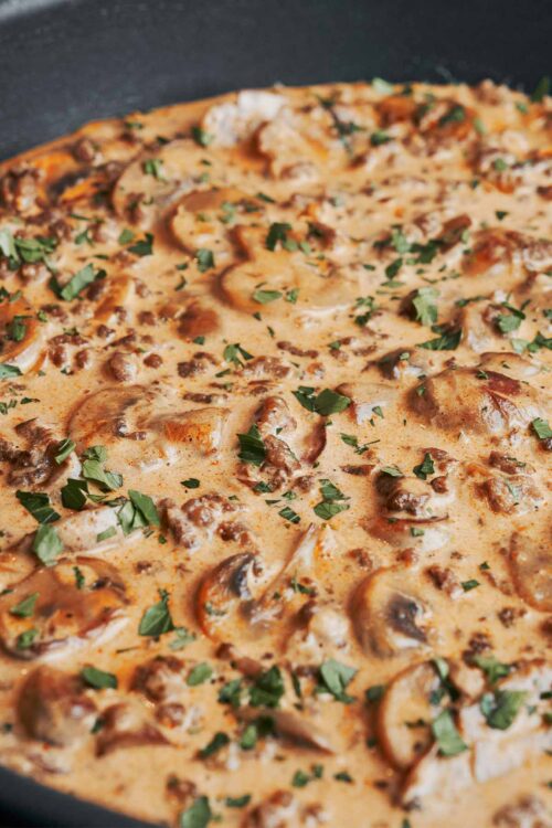 creamy ground beef stroganoff with mushrooms and fresh parsley