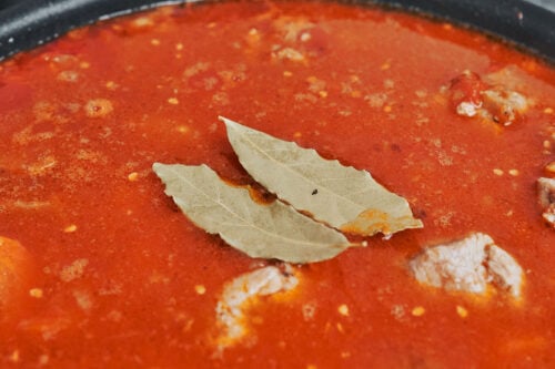 bay leaves added to pork stew sauce