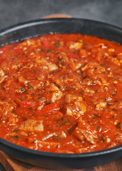 thick pork stew with tender meat and bell peppers