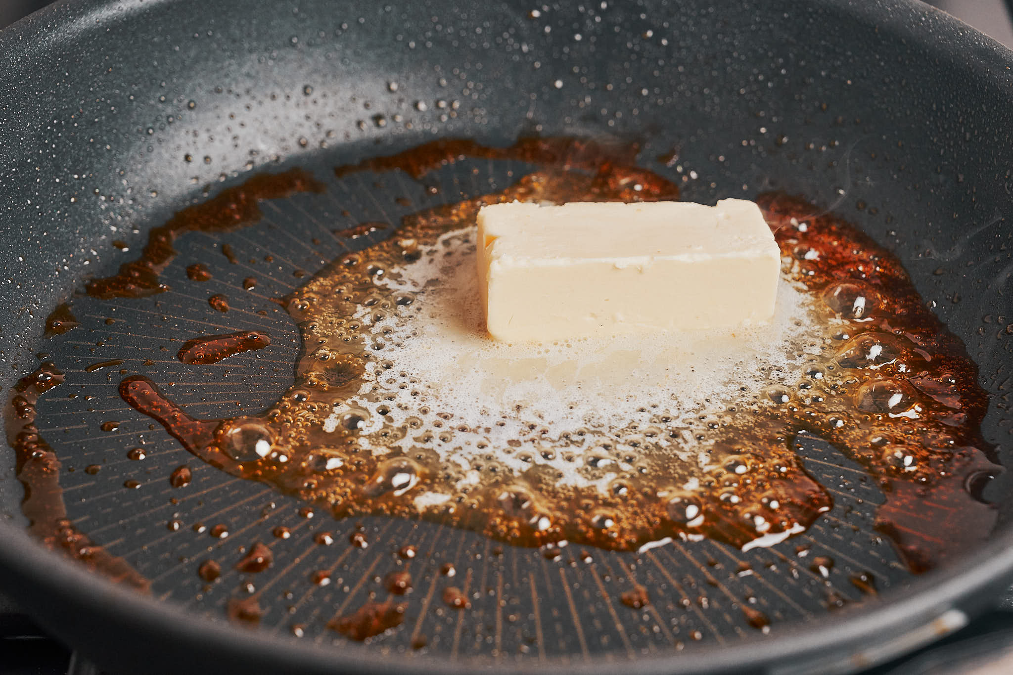butter melting in a skillet to start building the creamy sauce