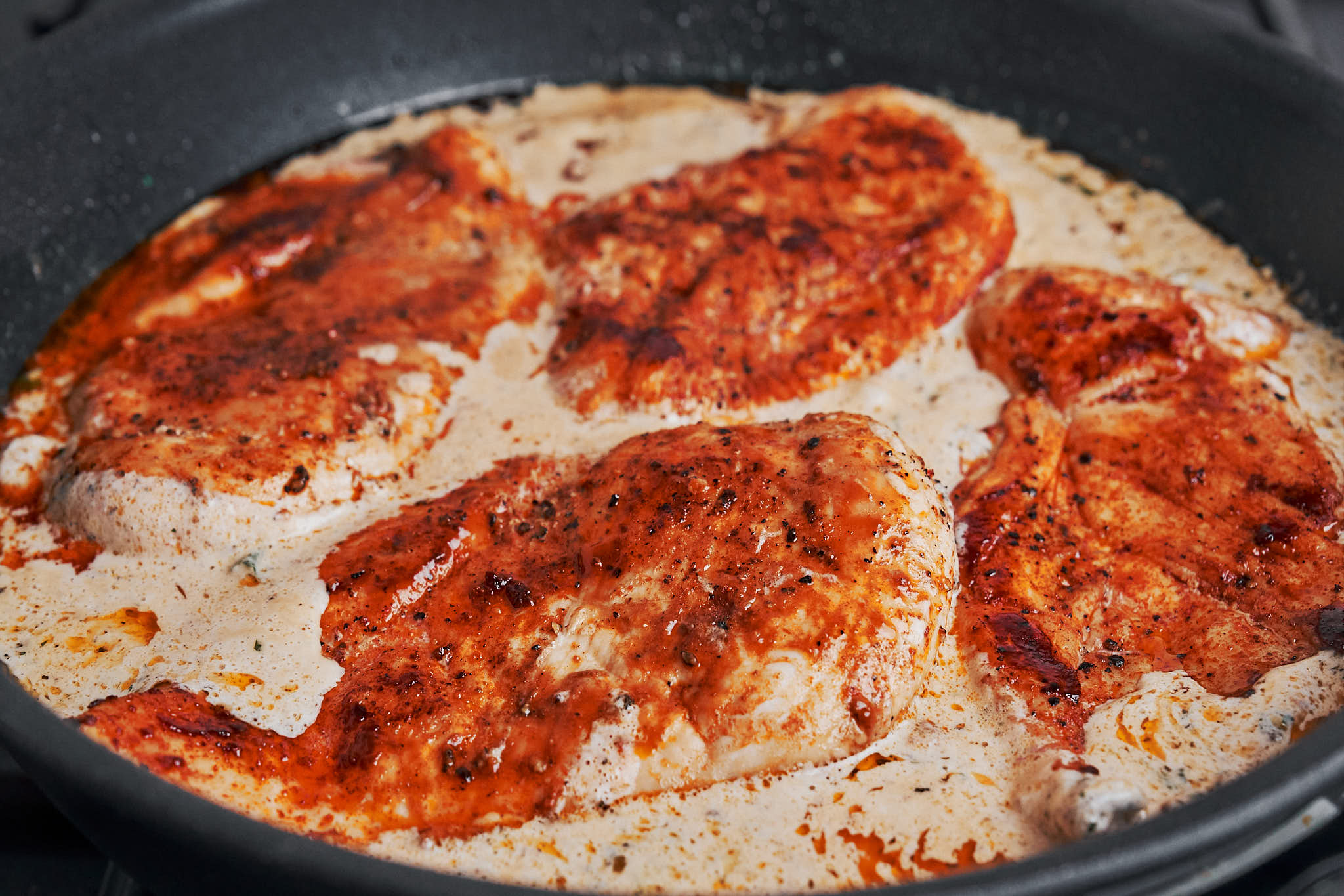 chicken breasts returned to the skillet with the creamy sauce