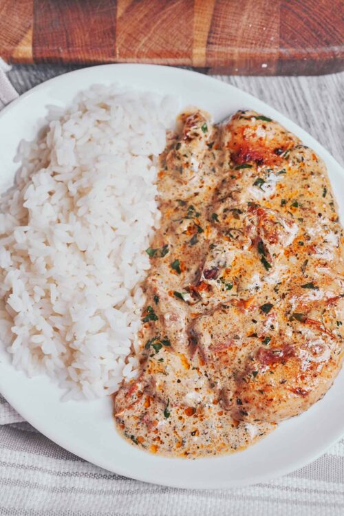 creamy sun dried tomato chicken served for a cozy dinner