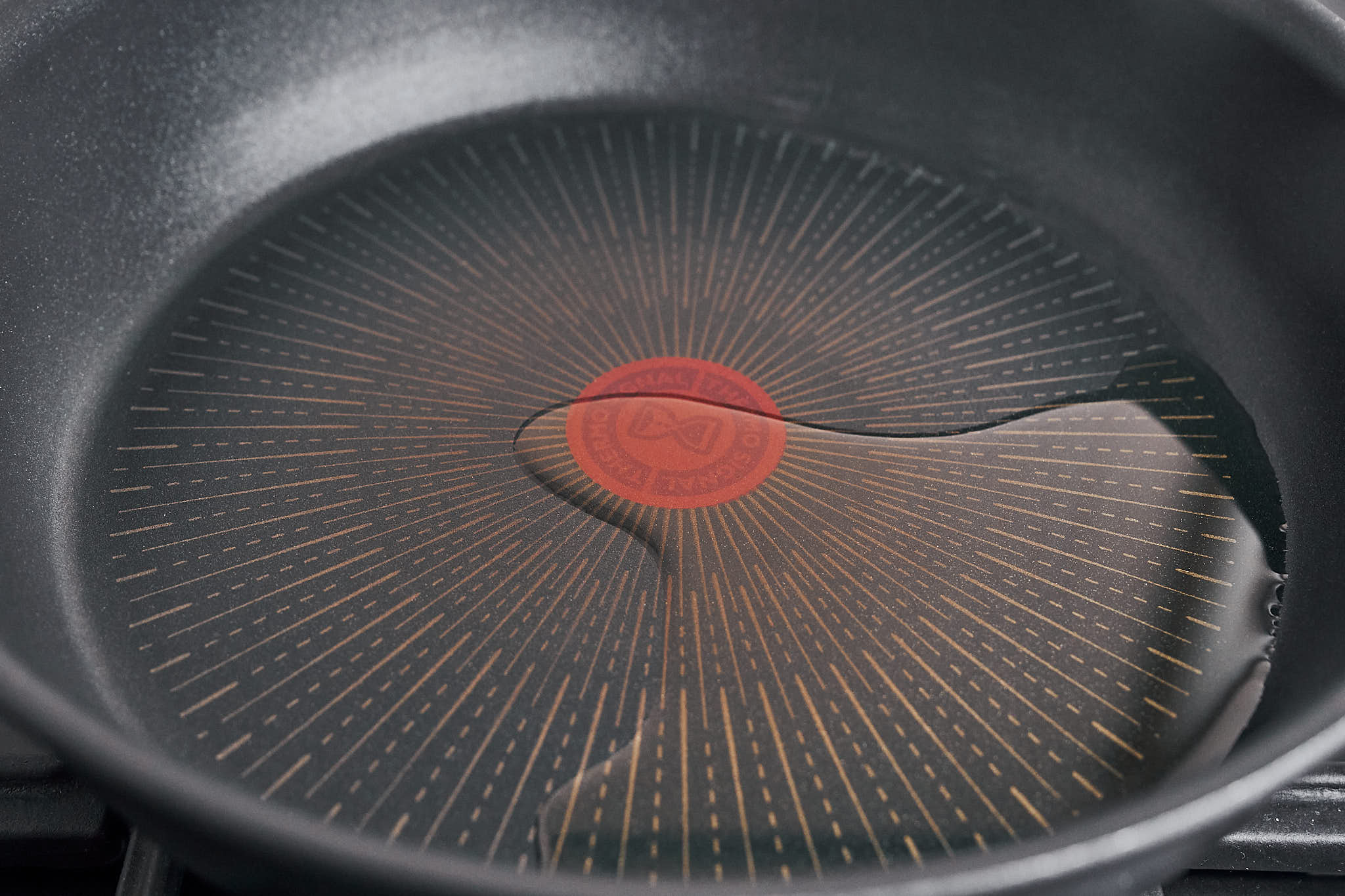 olive oil warming in a skillet getting ready to cook the chicken