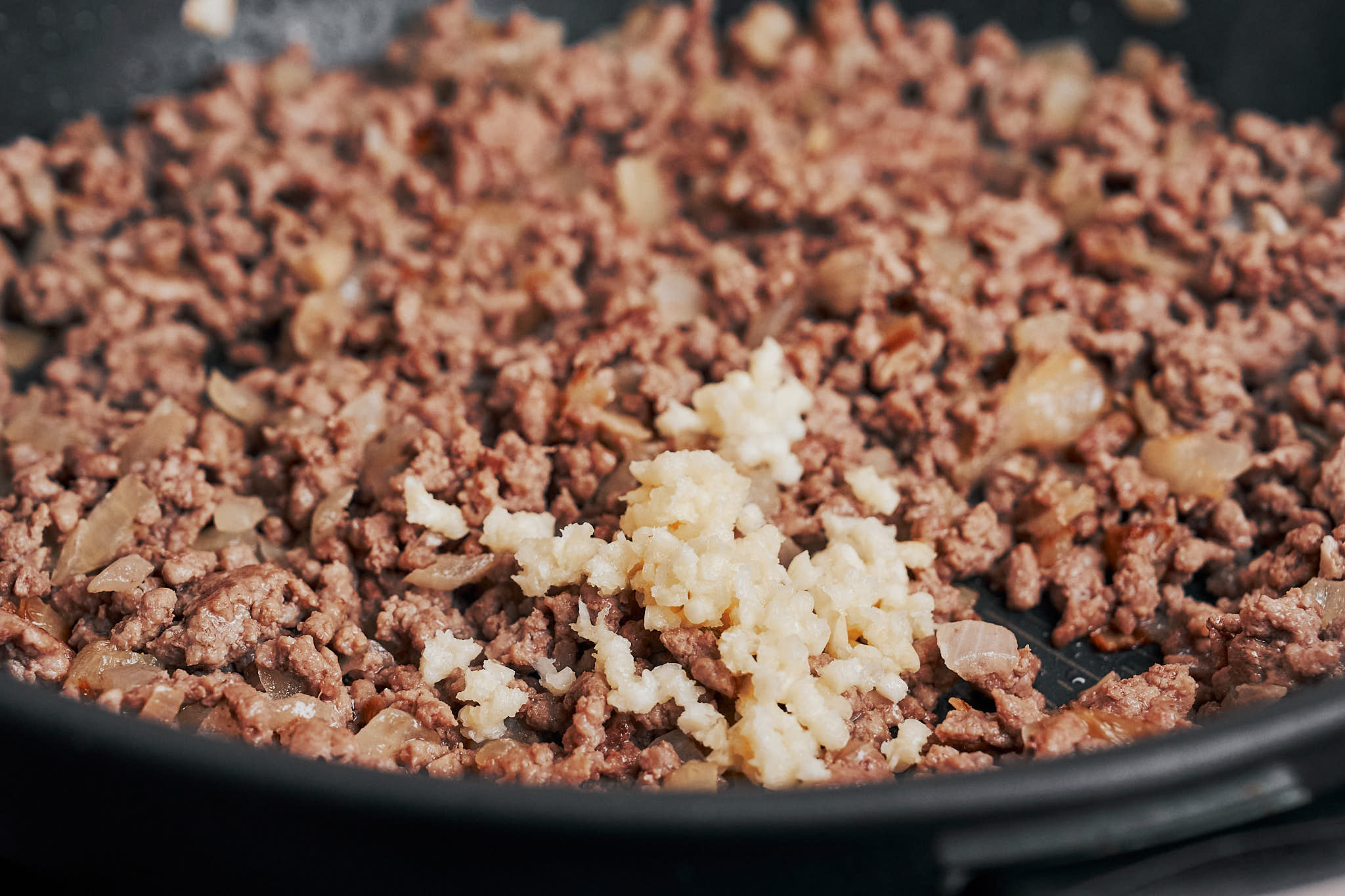 garlic added to the browned beef to build even more savory flavor