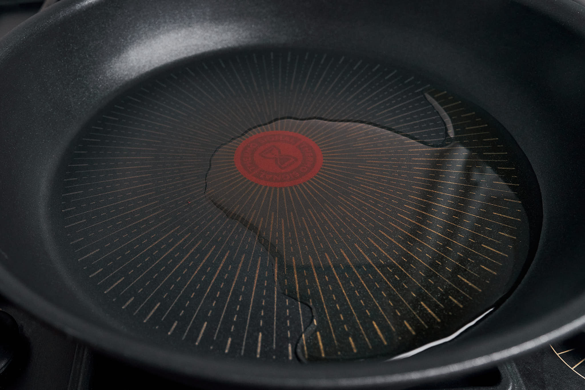 olive oil warming in a large skillet before the onion goes in