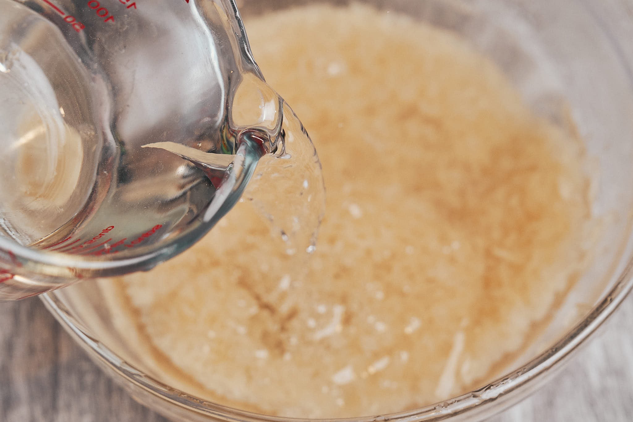 pouring water over the rice for soaking