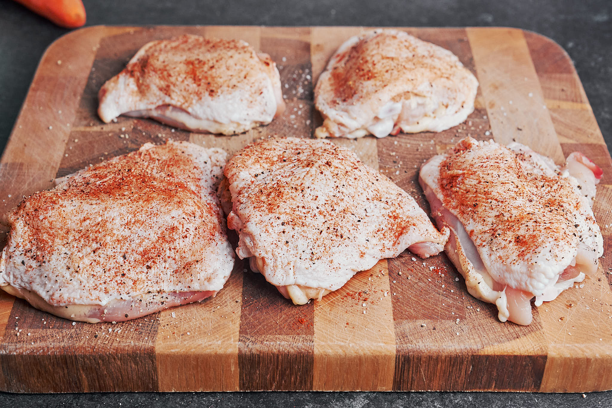 seasoned chicken thighs ready for the skillet