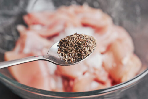 seasoning chicken thighs with black pepper